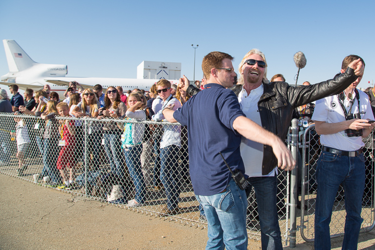 Richard Branson and Scaled Composites engineer Jason DiVenere celebrate the safe landing of SpaceShipTwo with a chest bump. Scaled Composites is the company which has built and is testing both SpaceShipTwo and its carrier aircraft WhiteKnightTwo.
